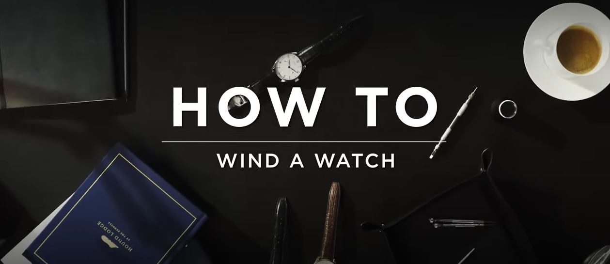 flatlay of a watch and materials used for winding